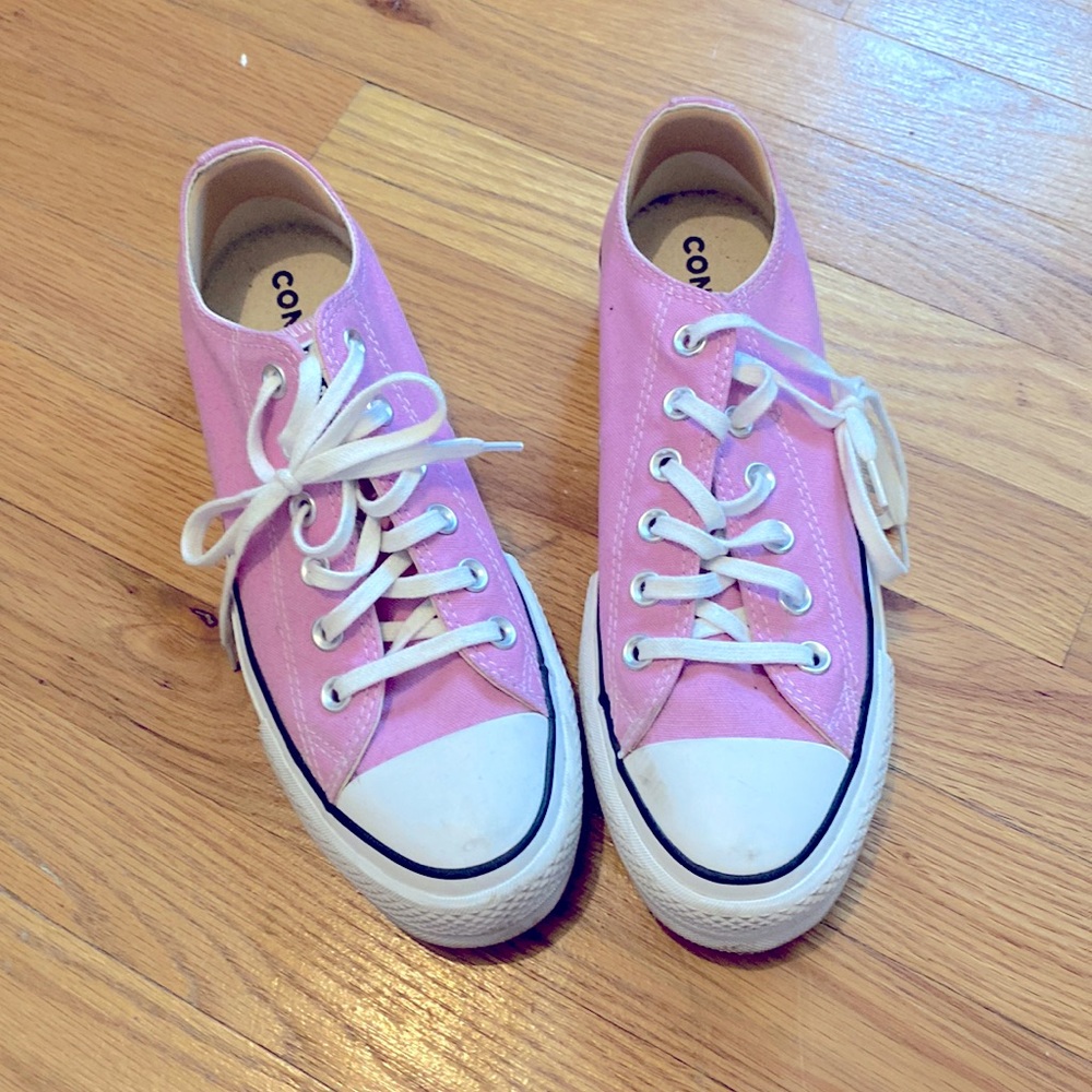 Barely worn pink converse with low platform soles.